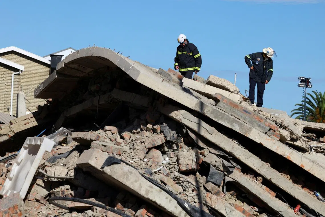 FILE PHOTO: Rescuers work to rescue construction workers trapped under a building that collapsed in George, South Africa May 8, 2024. REUTERS/Esa Alexander/File Photo