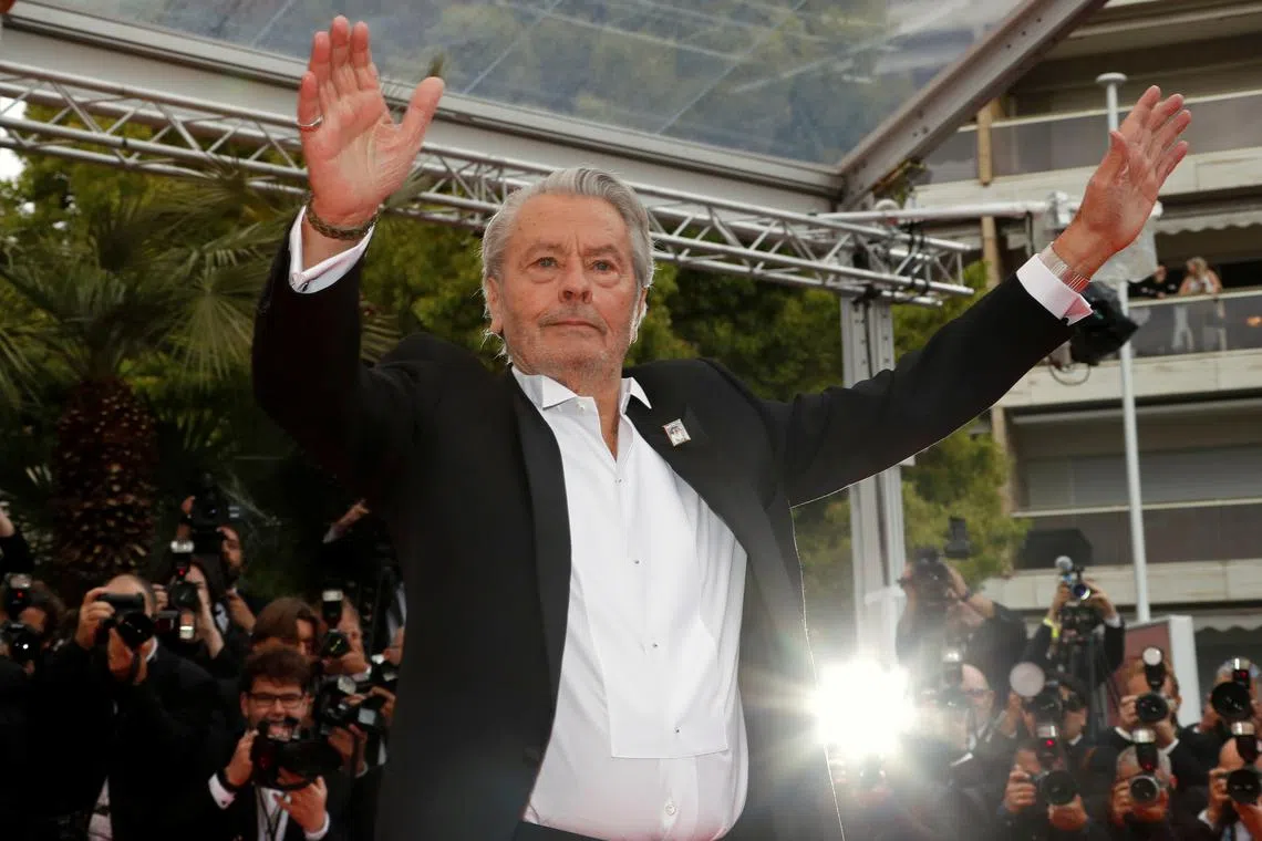 72nd Cannes Film Festival - Red Carpet Arrivals - Cannes, France, May 19, 2019. Alain Delon poses before receiving his honorary Palme d'Or Award. REUTERS/Eric Gaillard/File Photo