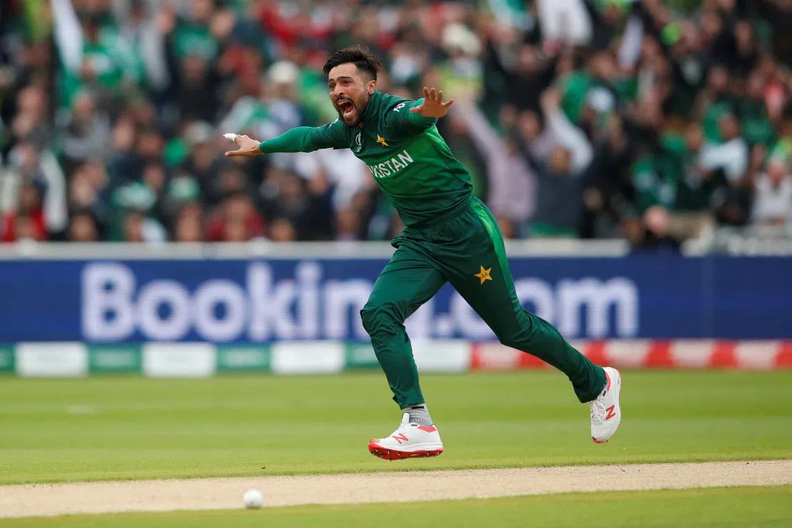 FILE PHOTO: Cricket - ICC Cricket World Cup - New Zealand v Pakistan - Edgbaston, Birmingham, Britian - June 26, 2019 Pakistan's Mohammad Amir celebrates taking the wicket of New Zealand's Martin Guptill   Action Images via Reuters/Andrew Boyers/File Photo