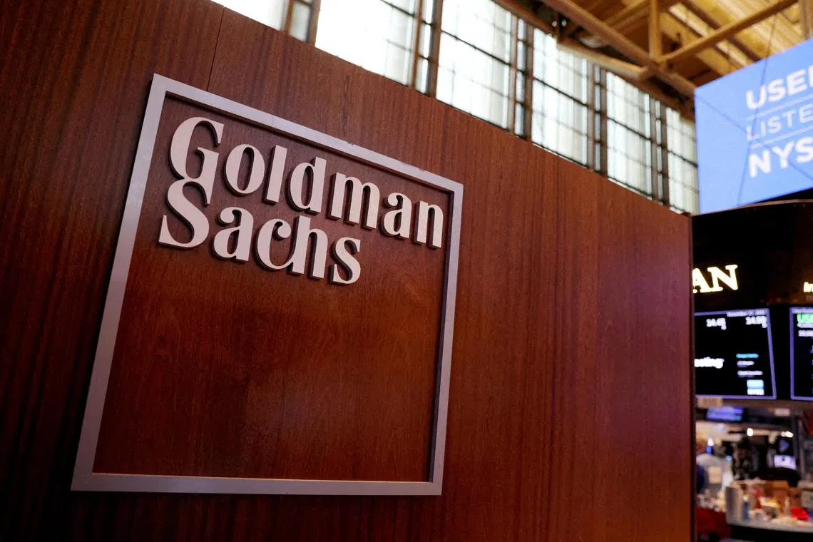 FILE PHOTO: FILE PHOTO: The logo for Goldman Sachs is seen on the trading floor at the New York Stock Exchange (NYSE) in New York City, New York, U.S., November 17, 2021. REUTERS/Andrew Kelly//File Photo/File Photo