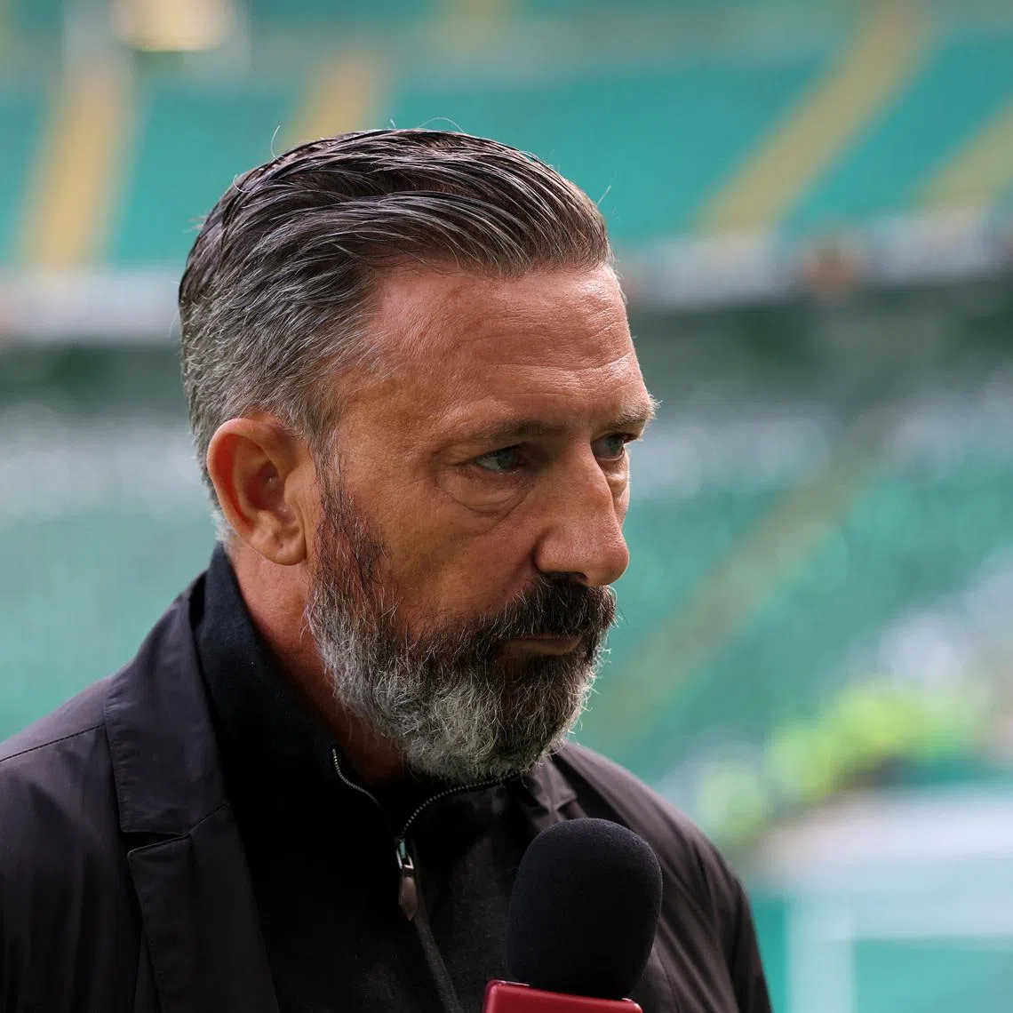 Soccer Football - Scottish Premiership - Celtic v Heart of Midlothian - Celtic Park, Glasgow, Scotland, Britain - May 16, 2026 Heart of Midlothian manager Derek McInnes speaks to media inside the stadium before the match REUTERS/Russell Cheyne