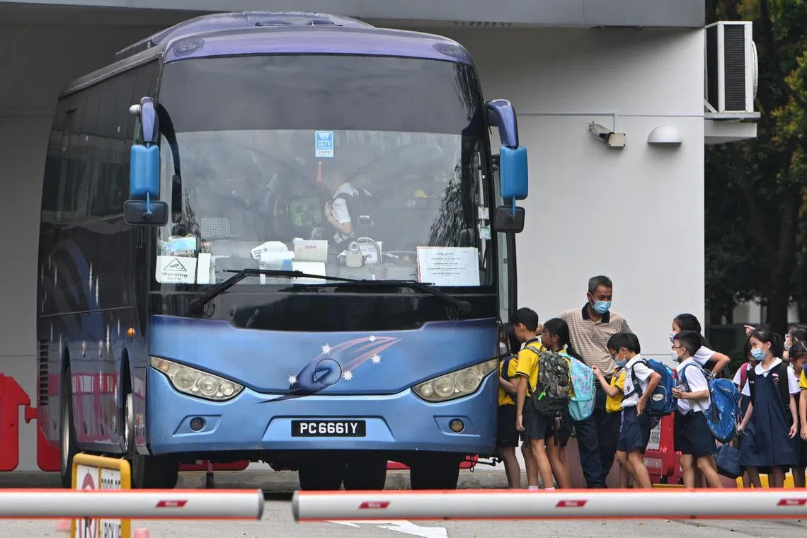 Students boarding the school bus at Punggol View Primary School on Jan 4, 2022.
