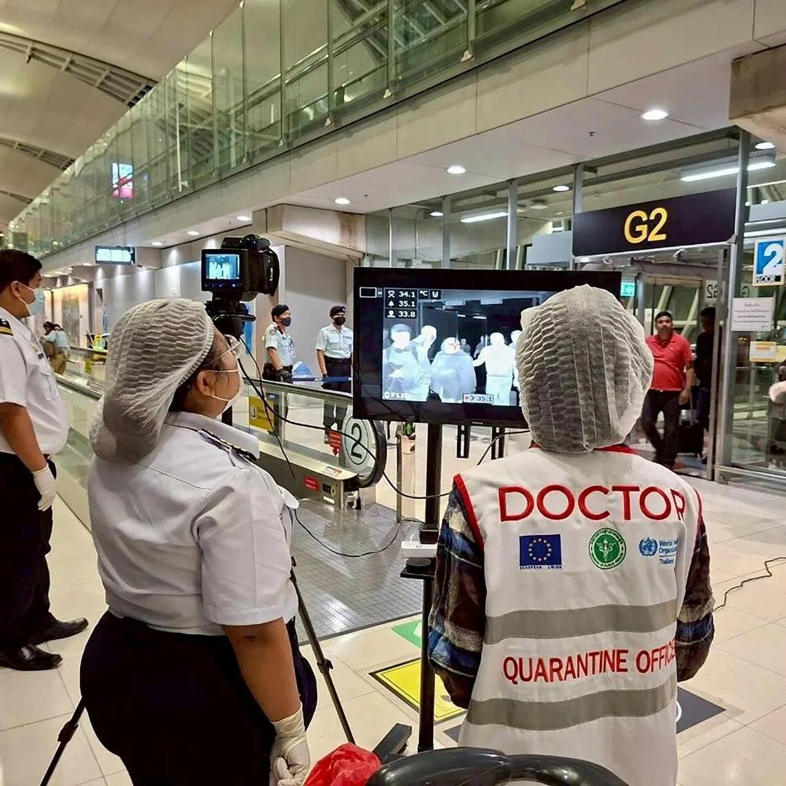 Airport health authorities wearing protective masks monitor passengers from international flights arriving at Suvarnabhumi International Airport in Bangkok, Thailand, January 25, 2026, following the implementation of health screening measures for passengers arriving from West Bengal, India, amid reports of a Nipah virus outbreak. Suvarnabhumi Airport Office /Handout via REUTERS    THIS IMAGE HAS BEEN SUPPLIED BY A THIRD PARTY.NO RESALES. NO ARCHIVES