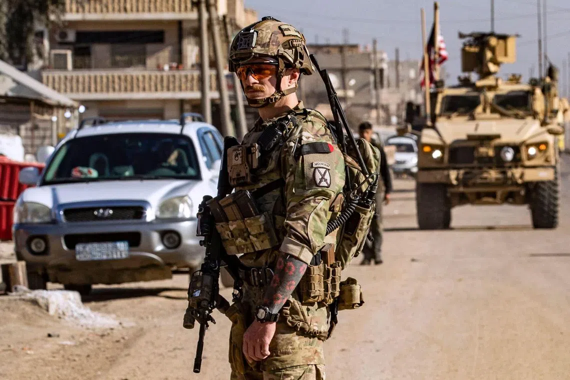 US soldiers patrolling on Jan 9 in Syria's Hasakeh province, which is mostly controlled by Kurdish-led Syrian Democratic Forces.