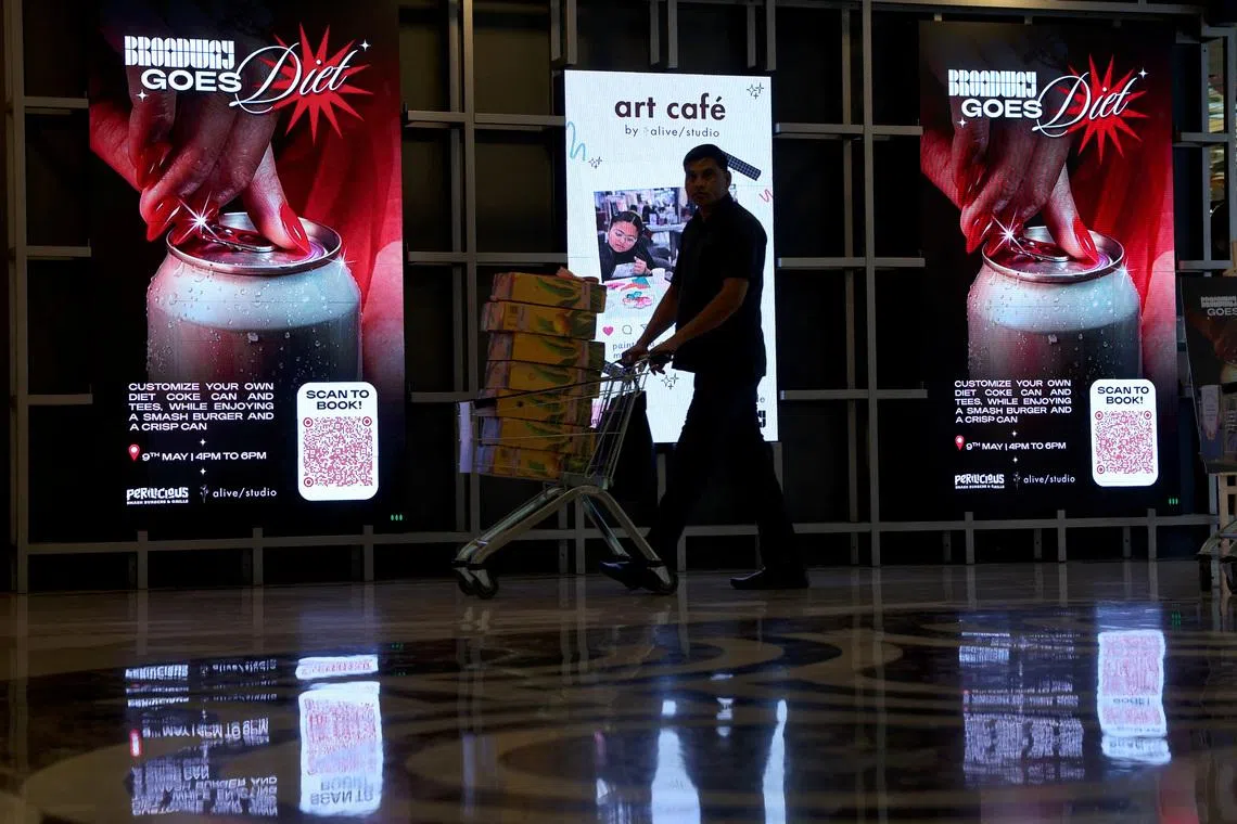 Screens displaying advertisements for an upcoming "Diet Coke party" in New Delhi, India, on May 5, amid an aluminium can shortage caused by the closure of the Strait of Hormuz.