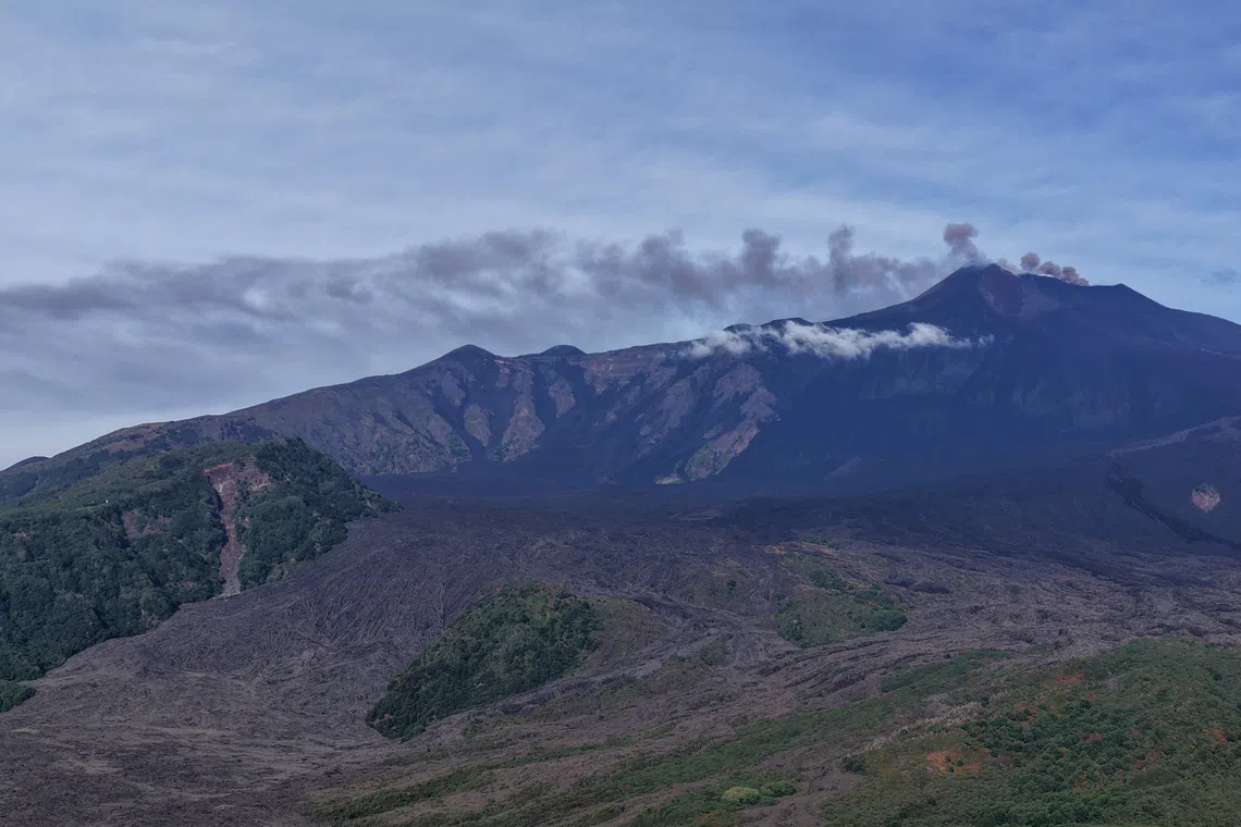 A view shows volcanic ash and fumes rising during an eruption at Mount Etna, as seen from Milo, Sicily, Italy, September 14, 2026. Giuseppe Di Stefano/Etna Walk/Handout via REUTERS