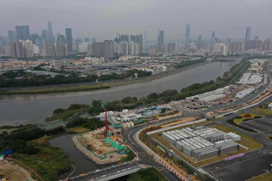 An aerial view shows buildings in the southern Chinese city of Shenzhen from Hong Kong on January 4, 2023, ahead of the opening of the border on January 8. - The border has been effectively shut for nearly three years while China enforced a zero-Covid strategy of snap lockdowns, travel restrictions and mass testing that battered the world's second-largest economy. (Photo by Peter PARKS / AFP)