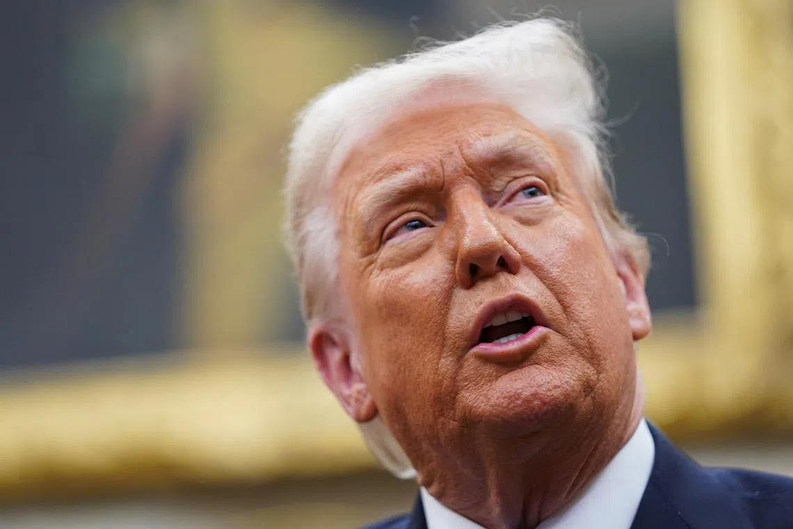 FILE PHOTO: U.S. President Donald Trump speaks during a meeting with Jordan's King Abdullah (not pictured) in the Oval Office at the White House in Washington, U.S., February 11, 2025. REUTERS/Nathan Howard/File Photo