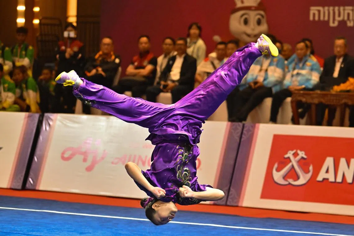 Kimberly Ong goes airborne in the women's changquan final on May 12. She finished eighth, a day after winning the daoshu-gunshu gold. 