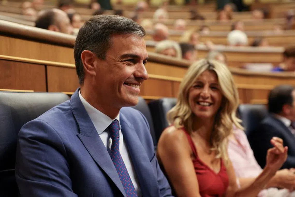 Spain's left-wing Sumar leader Yolanda Diaz and Spain's acting Prime Minister and Socialist Party (PSOE) leader Pedro Sanchez sit on the day of a parliament session where lawmakers vote for a speaker and for members of the parliament's executive board, as Spain's new parliament is constituted, following an inconclusive snap election on July 23, opening the race for PM nomination, at the Spanish parliament, in Madrid, Spain, August 17, 2023. REUTERS/Violeta Santos Moura