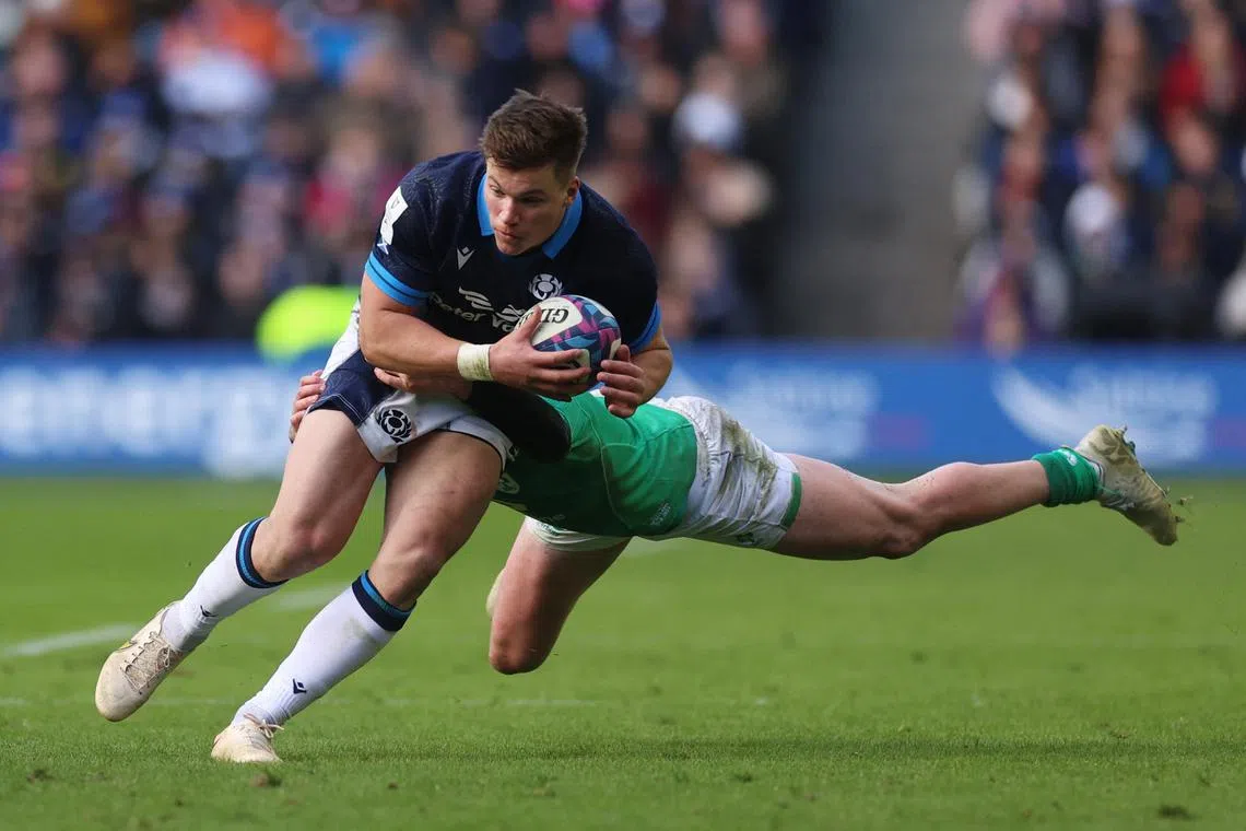 Scotland's Huw Jones in action with Ireland's Mack Hansen.