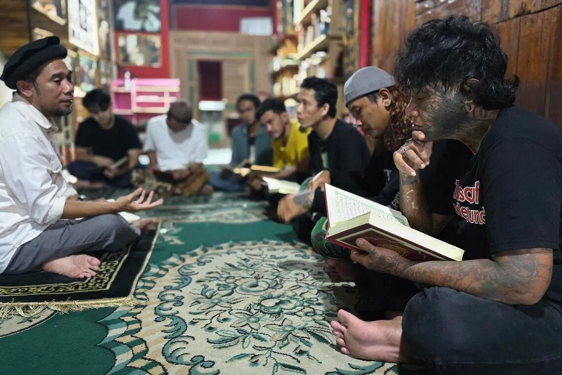 Mr Ahmad Rezki Fauzi (far right) used to swallow 20 to 30 Tramadol pills at a time, sometimes taking stronger opioids, washed down with alcohol.