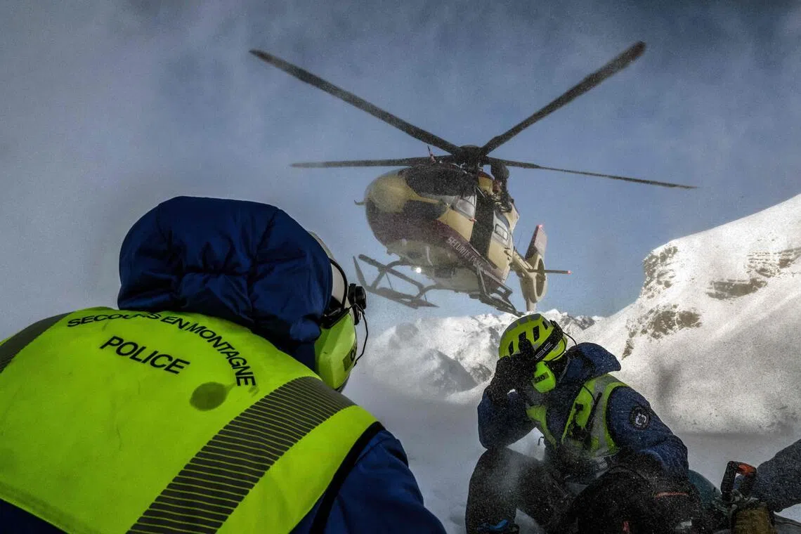 Mountain rescuers launching an avalanche emergency response mission in the French Alps on Jan 29.  At least 25 avalanche deaths have occurred in France this winter season, most of them since January.