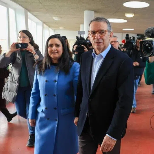 Presidential candidate Antonio Jose Seguro (right) and his wife Margarida Maldonado Freitas leave after voting in Caldas da Rainha, Portugal, on Feb 8.