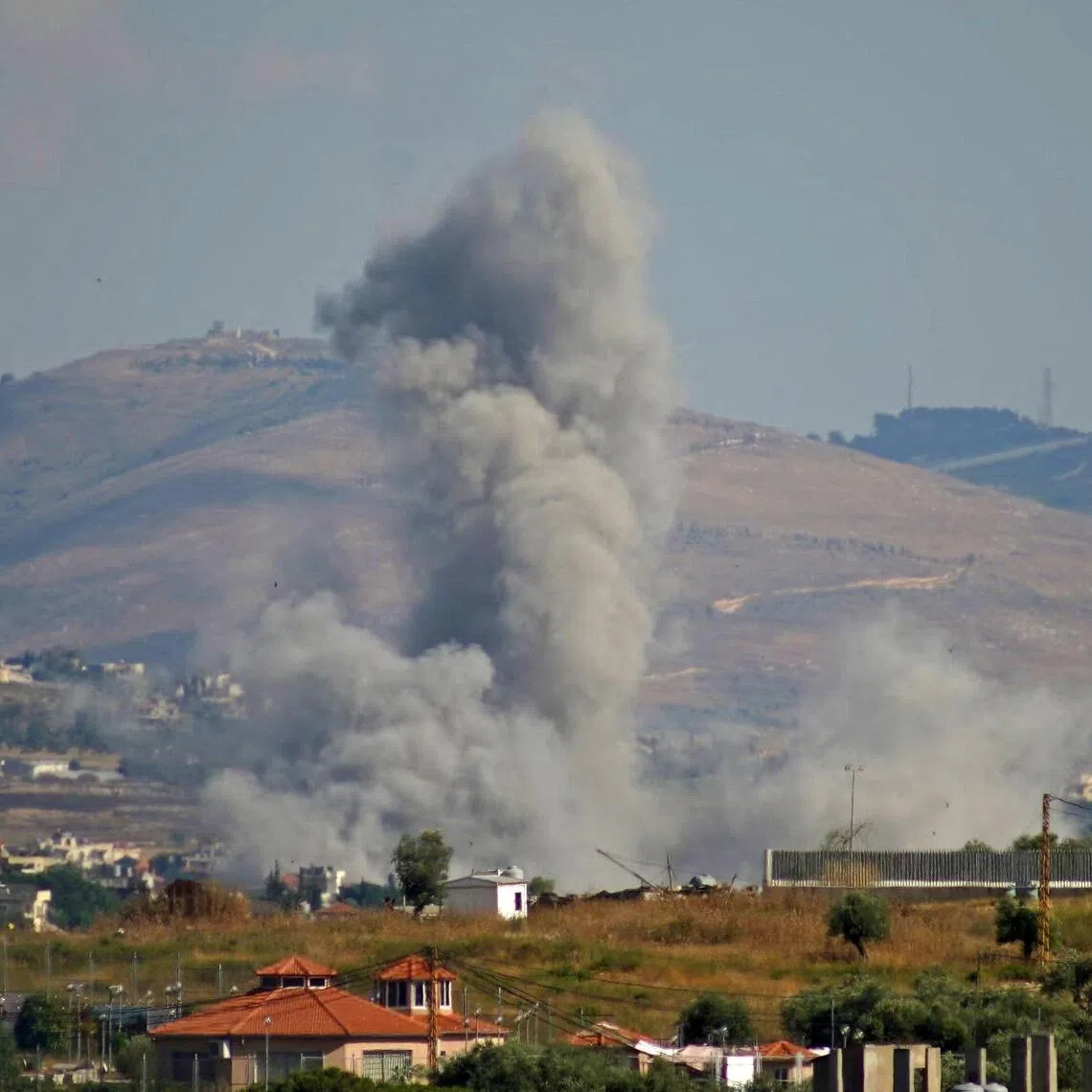 Smoke rises from the site of an Israeli air strike that targeted the southern Lebanese village of Kfar Tibnit on June 13.