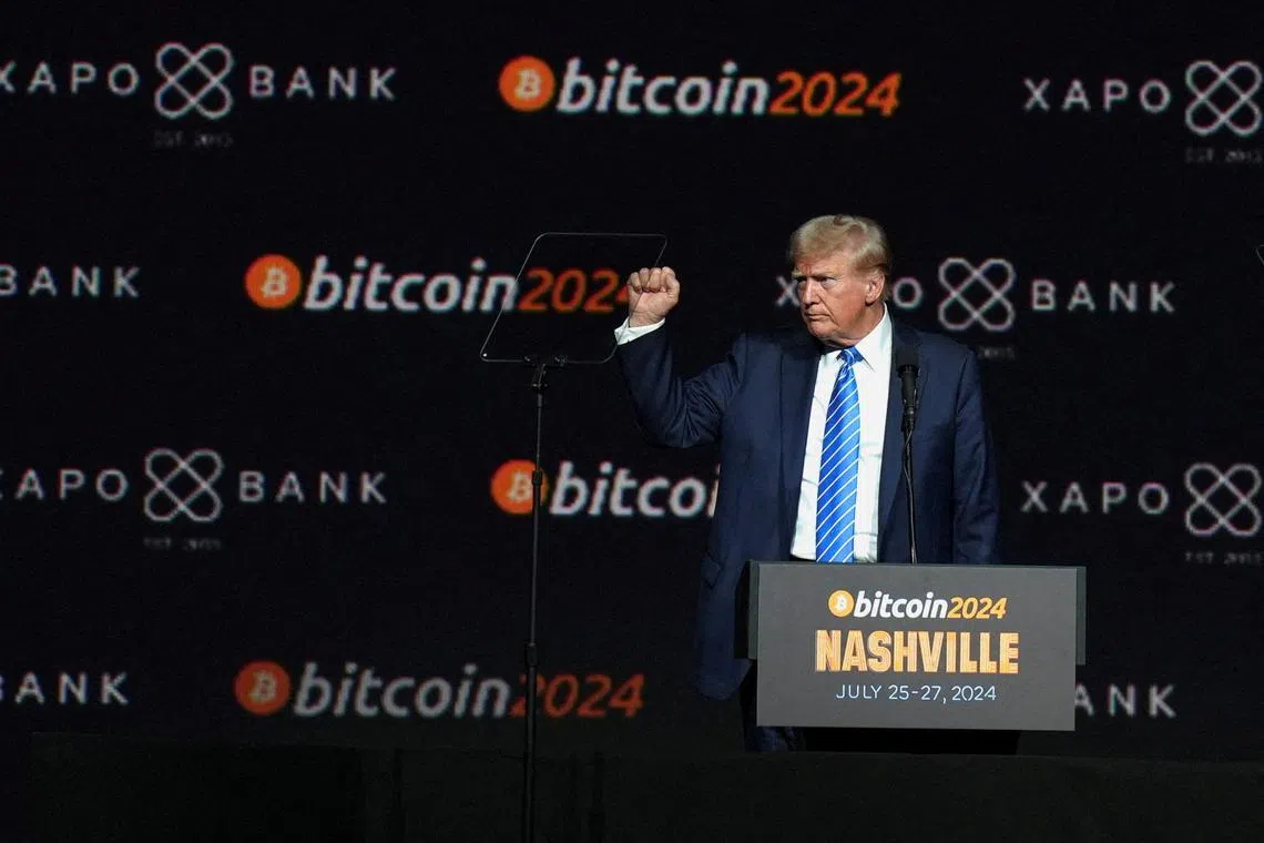 FILE PHOTO: Republican presidential nominee and former U.S. President Donald Trump gestures at the Bitcoin 2024 event in Nashville, Tennessee, U.S., July 27, 2024. REUTERS/Kevin Wurm/File Photo