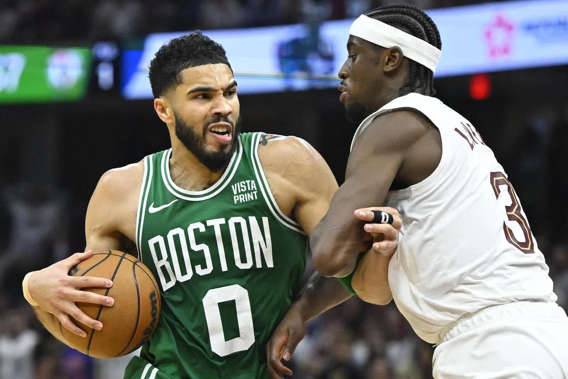 Boston Celtics forward Jayson Tatum drives against Cleveland Cavaliers guard Caris LeVert in the second quarter of Game 4 of the NBA Eastern Conference semi-finals.