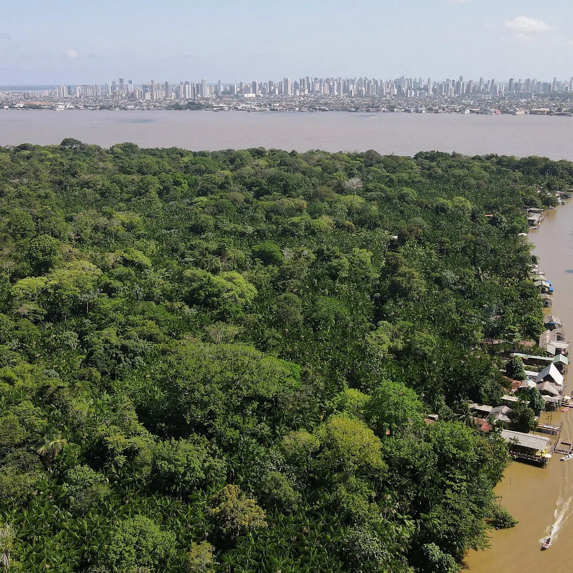 A view of the Amazon rainforest with the city of Belem in the background in August.