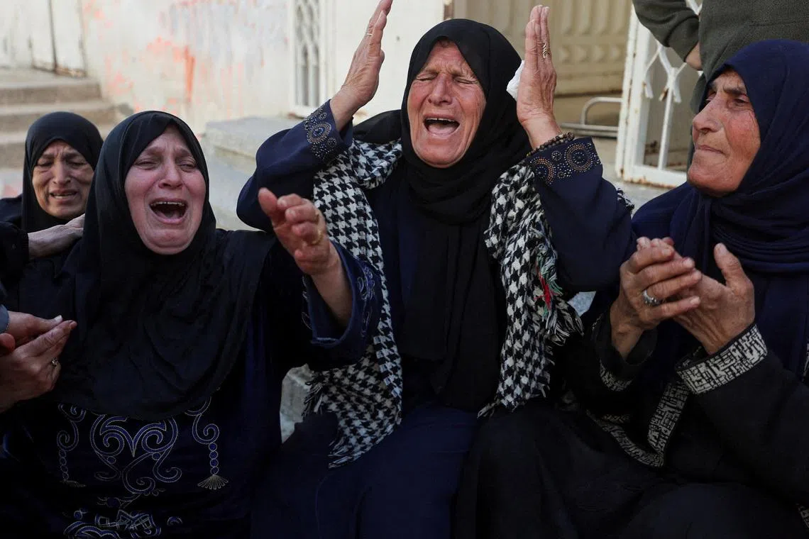 Mourners react during the funeral of Palestinians killed in an Israeli strike, according to medics, in Gaza City, March 28, 2026. REUTERS/Dawoud Abu Alkas