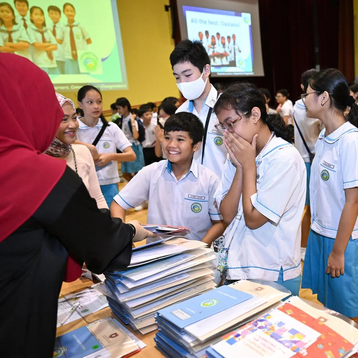 Oasis Primary School pupils collecting their PSLE results in
November 2024. The PSLE has long attracted criticism for its outsized influence on children, families and schools.