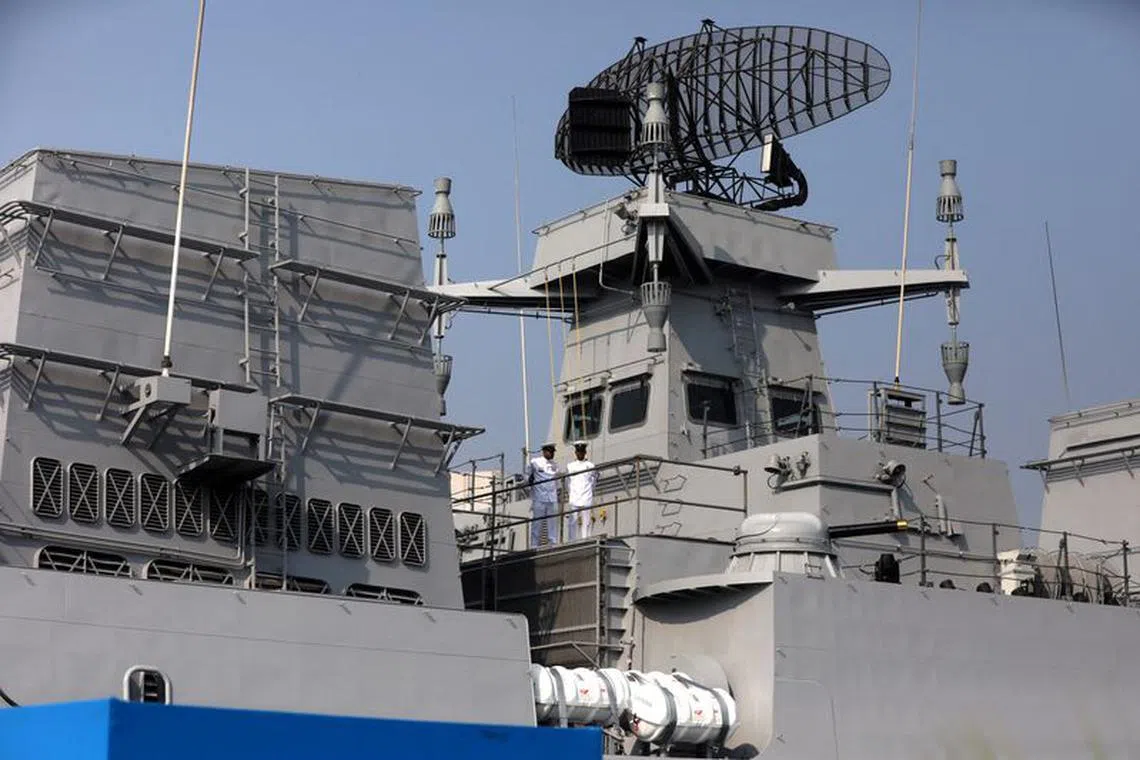 FILE PHOTO: Indian Navy officers stand on the deck of INS Mormugao, a stealth guided-missile destroyer ship of Project 15B, during its commissioning ceremony, in Mumbai, India, December 18, 2022. REUTERS/Niharika Kulkarni/File Photo