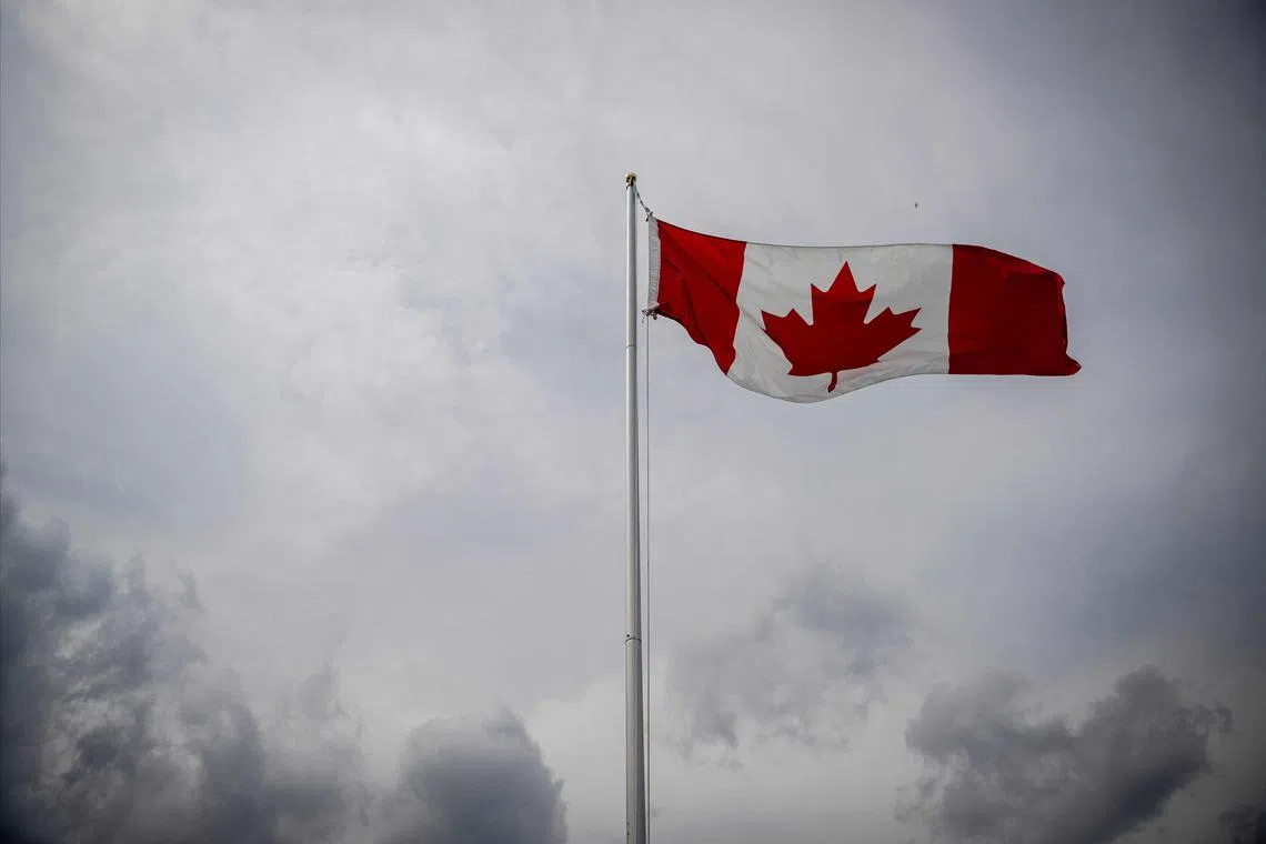 A Canadian flag flies during the Canada Day Celebrations in the Old Port in Montreal, Quebec, on July 1, 2025.s All About Family at Montreal's Old Port" in Montreal on July 1, 2025. (Photo by ANDREJ IVANOV / AFP)