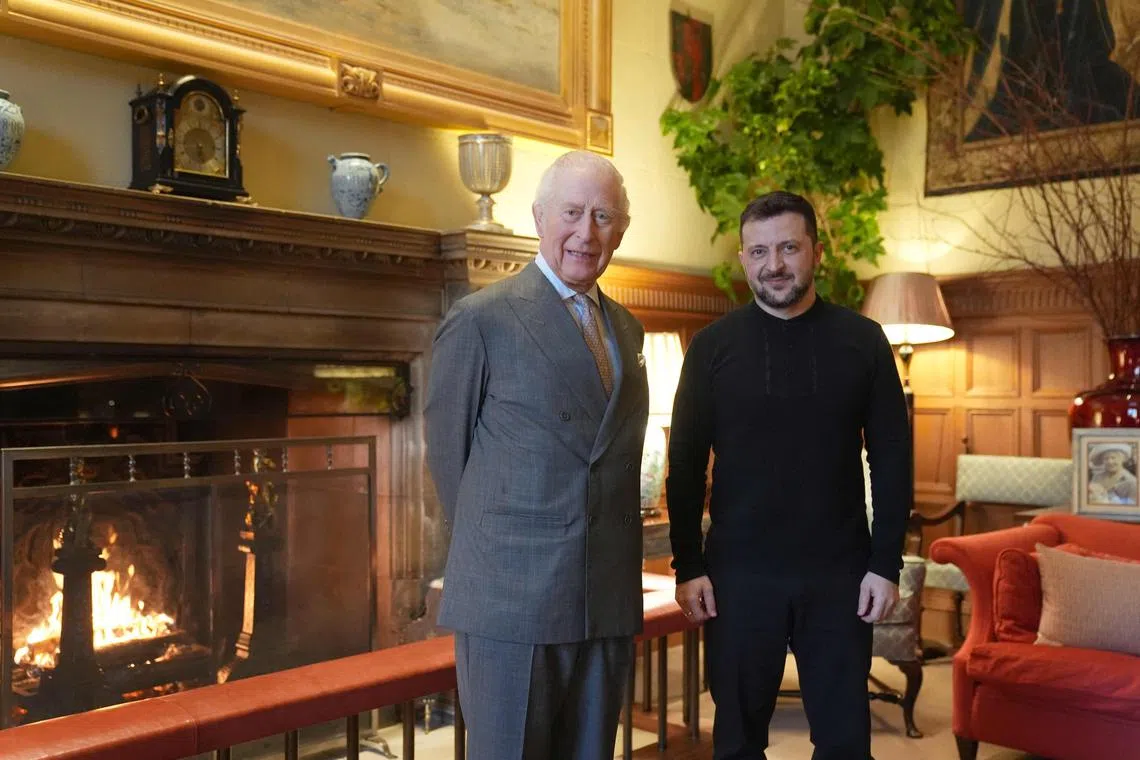 Britain's King Charles III and Ukraine's President Volodymyr Zelensky pose for a photo in the Saloon at Sandringham House during an audience on the Sandringham Estate in Norfolk, eastern England, on March 2, 2025.