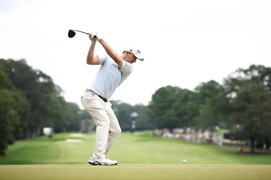 Russell Henley of the United States plays his shot from the first tee during the first round of the Tour Championship.