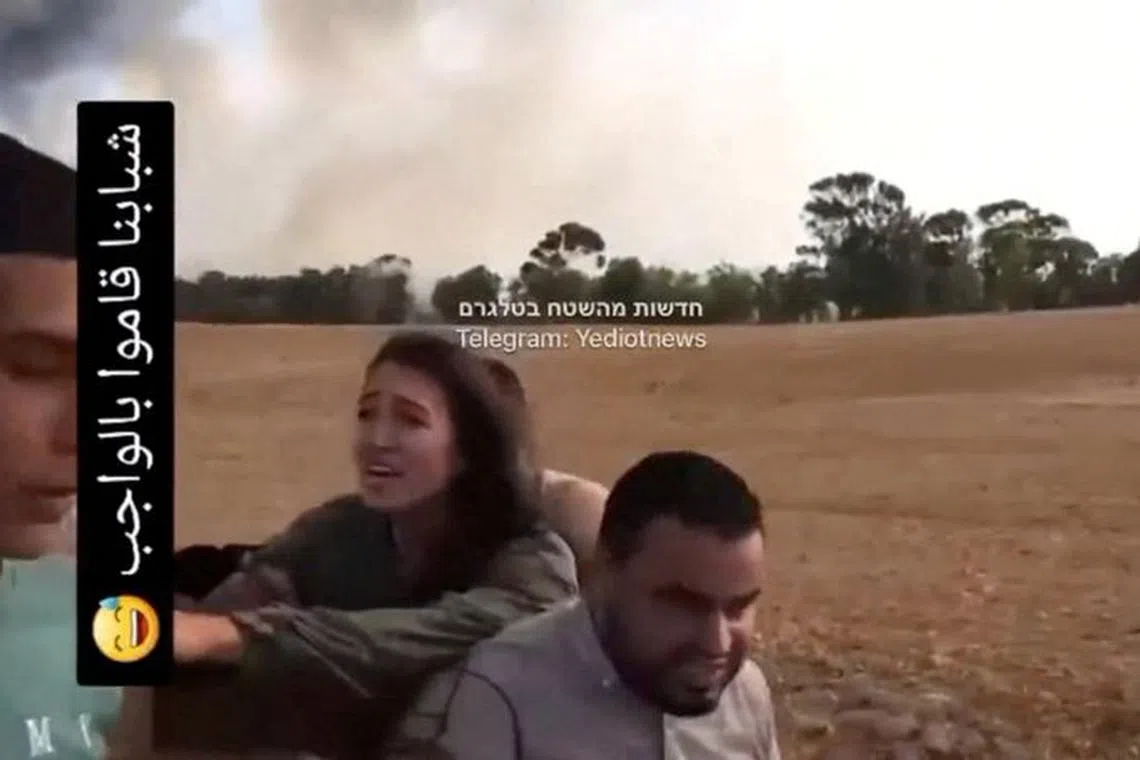 A screengrab from a social media video published on October 7, 2023 shows Noa Argamani as she is taken hostage by Palestinian militants, at an unknown location. Video obtained by Reuters/via REUTERS/File Photo
