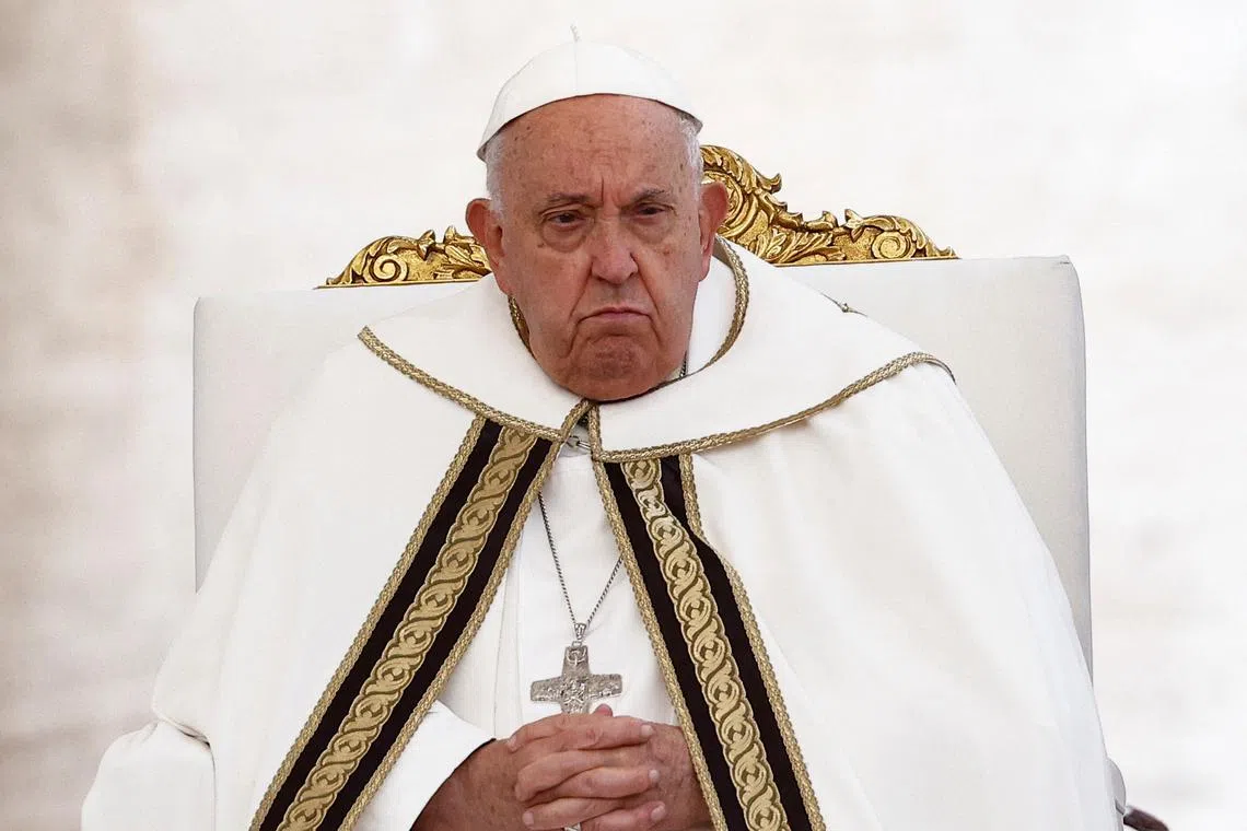 Pope Francis looks on, at a mass to open the Synod of Bishops in St. Peter's square at the Vatican, October 2, 2024. REUTERS/Guglielmo Mangiapane