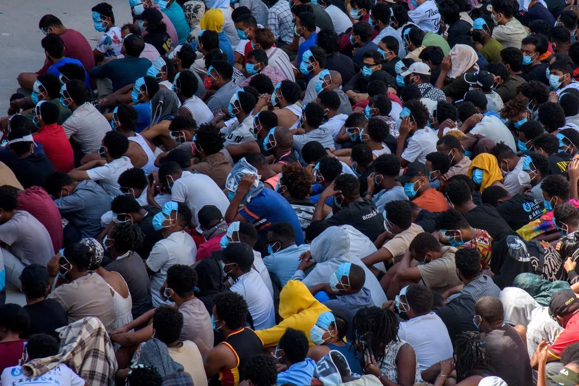 FILE PHOTO: Victims of scam centers who were tricked or trafficked into working in Myanmar, are stuck in limbo at a compound inside the KK Park, a fraud factory, and a human trafficking hub on the border with Thailand-Myanmar after a multinational crackdown on the compounds run by criminal gangs, operated by the Karen Border Guard Force (BGF) in Myawaddy, Myanmar, February 26, 2025. REUTERS/Stringer/File Photo