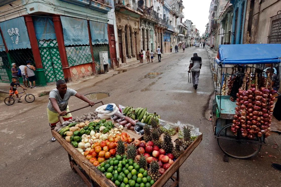A person sells food during a power outage in Havana, Cuba, on March 17.
