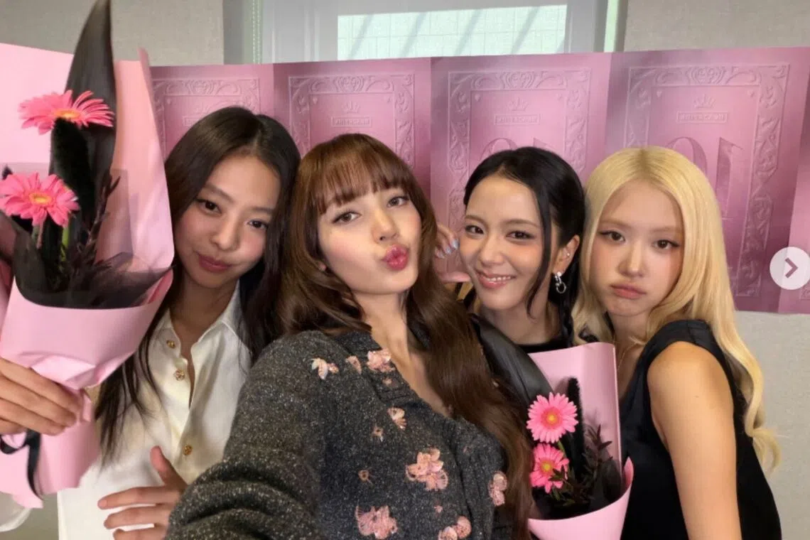 Blackpink members (from left) Jennie, Lisa, Jisoo and Rose posing for photos during their 10th anniversary meeting with fans at the National Museum of Korea in Seoul on Aug 8.