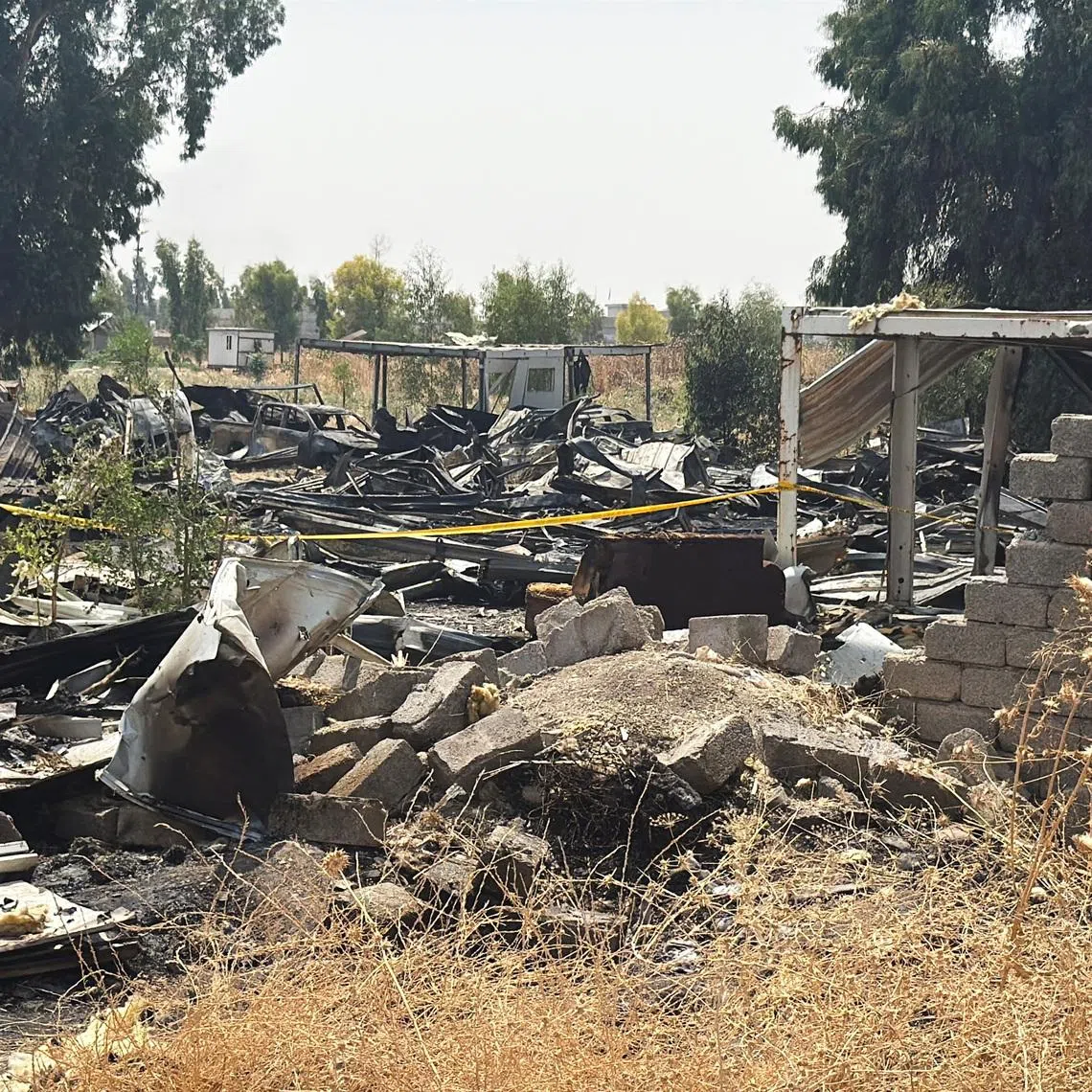 Damage at a site belonging to Iraq's Popular Mobilization Forces (PMF) following airstrikes that the PMF said were carried out by U.S. and Saudi forces, in Bartella, Nineveh province, Iraq, July 29, 2026.  Picture taken with a mobile phone. REUTERS/Khalid Al-Mousily