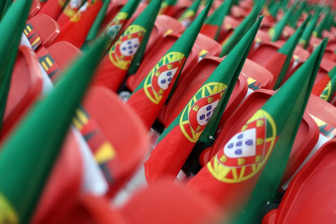 FILE PHOTO: FIFA World Cup Qatar 2022 - Quarter Final - Morocco v Portugal - Al Thumama Stadium, Doha, Qatar - December 10, 2022 Portugal flags are pictured inside the stadium before the match REUTERS/Carl Recine/File Photo