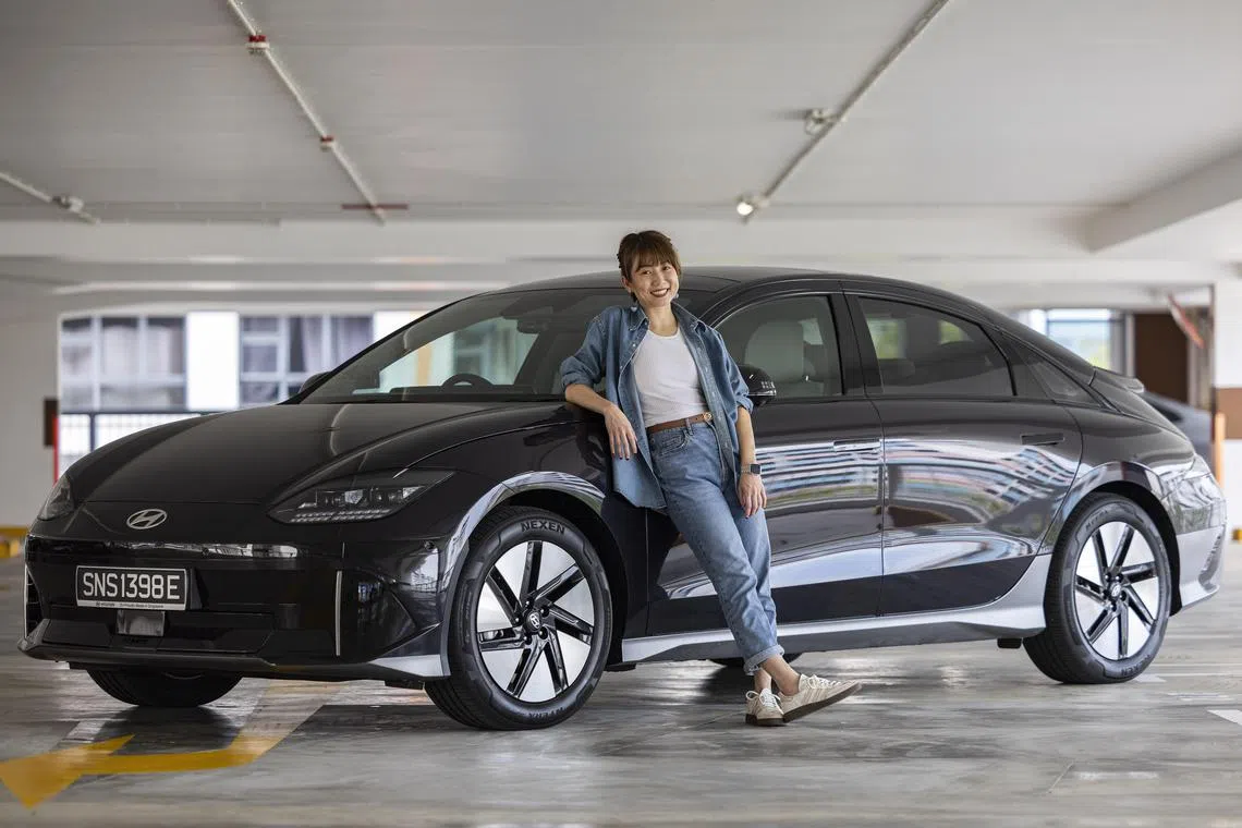 ST20250213_202517400784/auelectric21/Brian Teo/Audrey Tan/Profile of The Straits Times Assistant News Editor Audrey Tan with the Hyundai IONIQ Electric car at the 445 Clementi Avenue 3 multi-story carpark on Feb 13, 2025. ST PHOTO: BRIAN TEO
