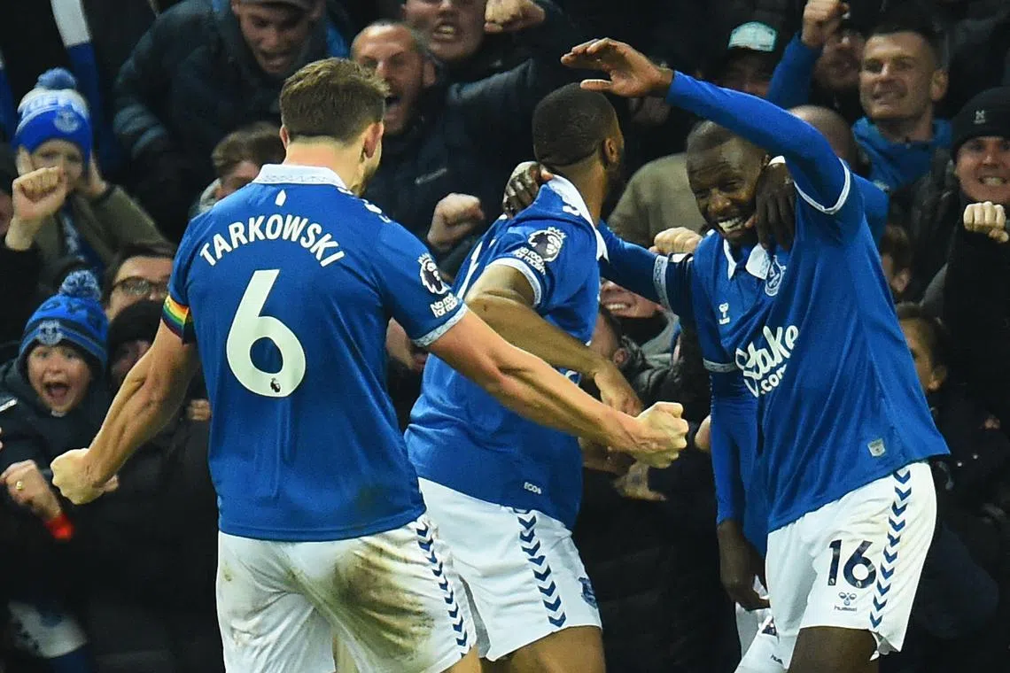 Everton midfielder Abdoulaye Doucoure (right) celebrates scoring the team's second goal.
