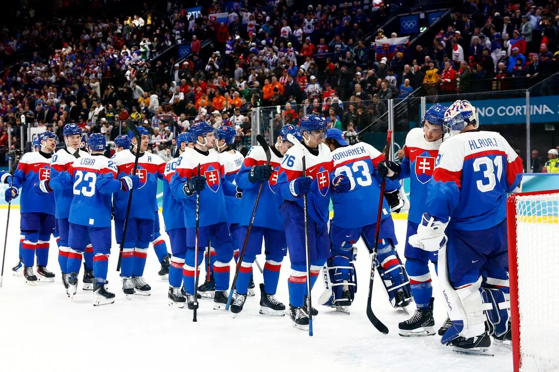 Milano Cortina 2026 Olympics - Ice Hockey - Men's Play-offs Quarterfinals - Slovakia vs Germany - Milano Santagiulia Ice Hockey Arena, Milan, Italy - February 18, 2026. Slovakia players celebrate after the match REUTERS/Alessandro Garofalo