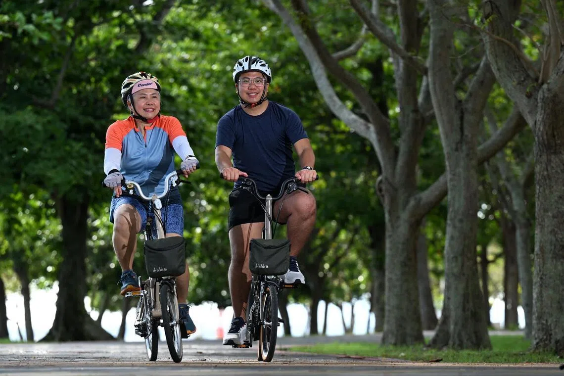 Jane Low (left) and her son, Stanford Chong cycling at Changi coast track on April 17. They will be participating in the  OCBC Cycle on May 10.