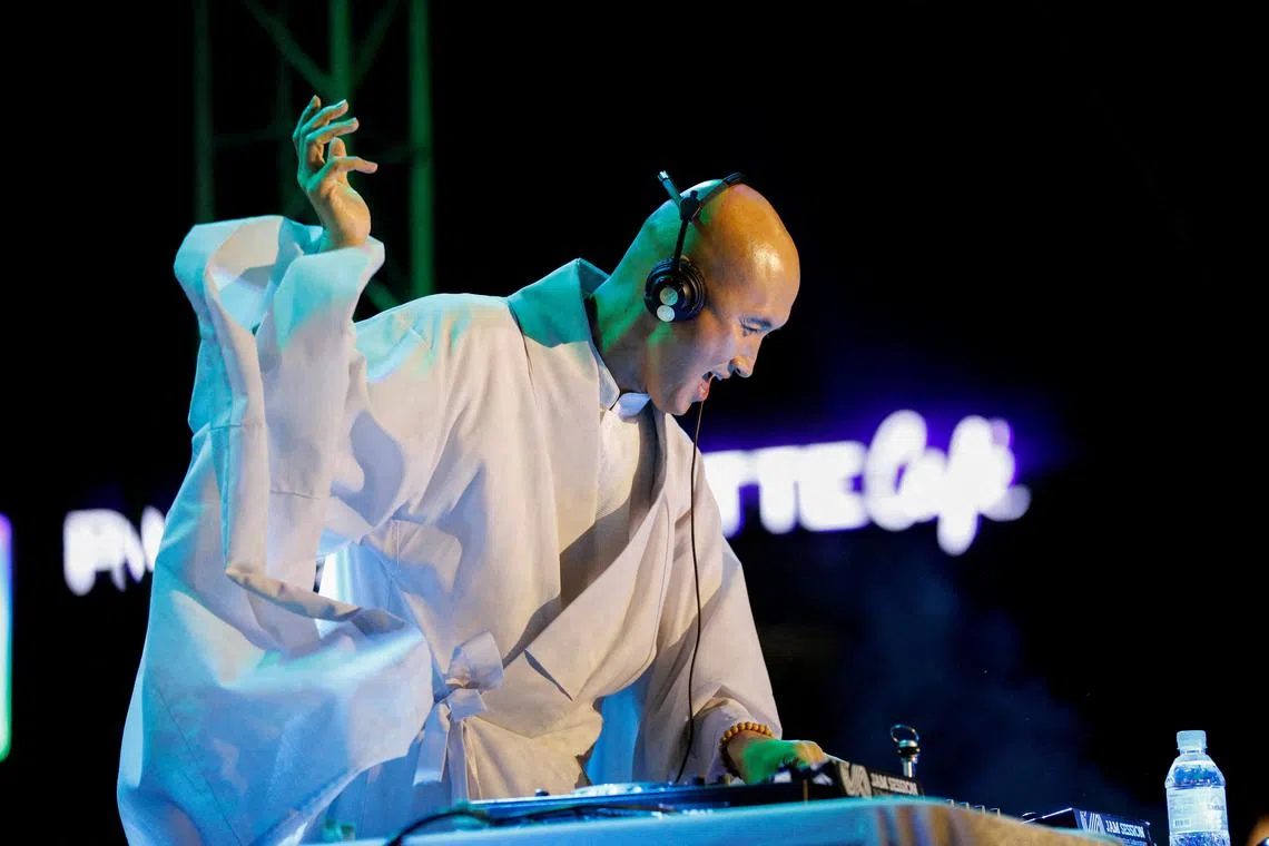 South Korean comedian Youn Sung-ho, known as NewJeansNim, performs at an electronic dance music party in Seoul, on May 12.