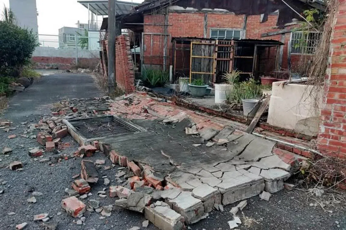 A collapsed wall of a house seen after an earthquake in Lucao township, Chiayi county in Taiwan, on Jan 21.