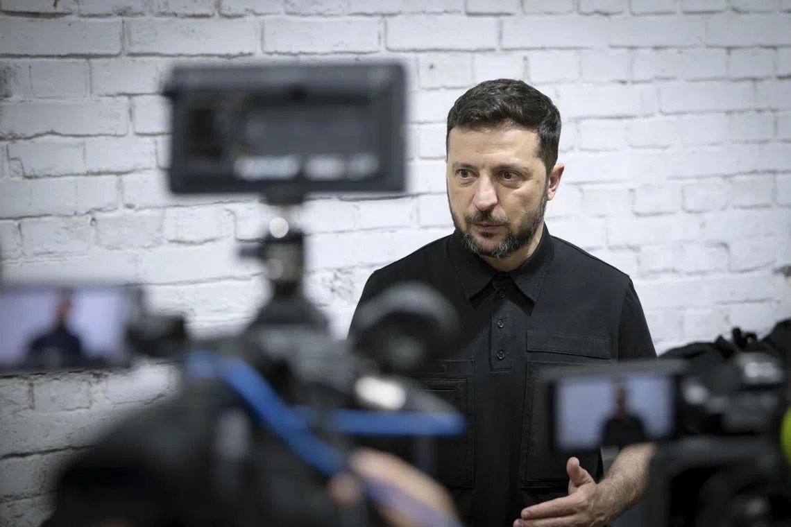 Ukrainian President Volodymyr Zelensky visiting a facility making interceptor drones at an undisclosed location in Ukraine on July 25.