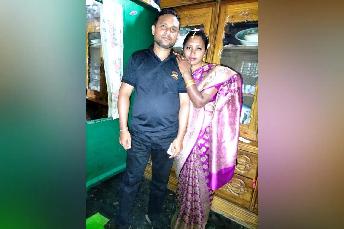 Mr Salim Hossain, who died in a workplace accident in Lentor Avenue on Sept 17, with his wife.