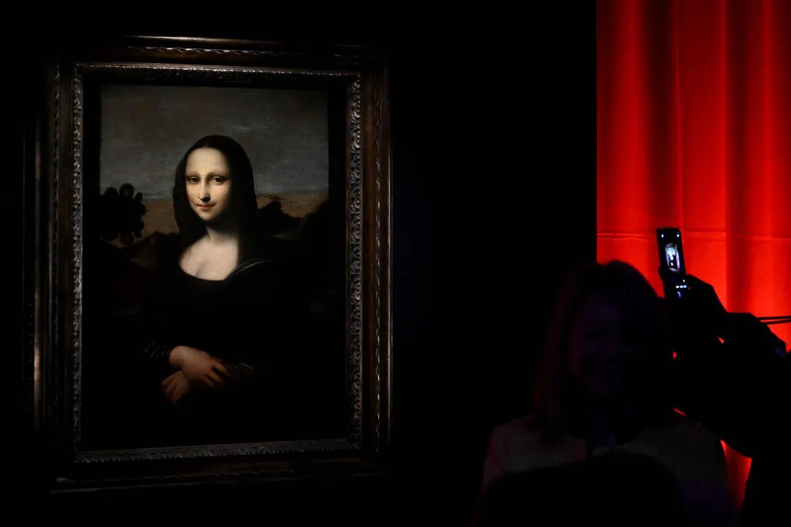 A visitor looking at the Isleworth Mona Lisa during the exhibition "Leonardo Da Vinci - La Prima Monna Lisa" (The First Mona Lisa) at the Palazzo della Promotrice delle Belle Arti in Turin, Italy on Nov 23, 2023.