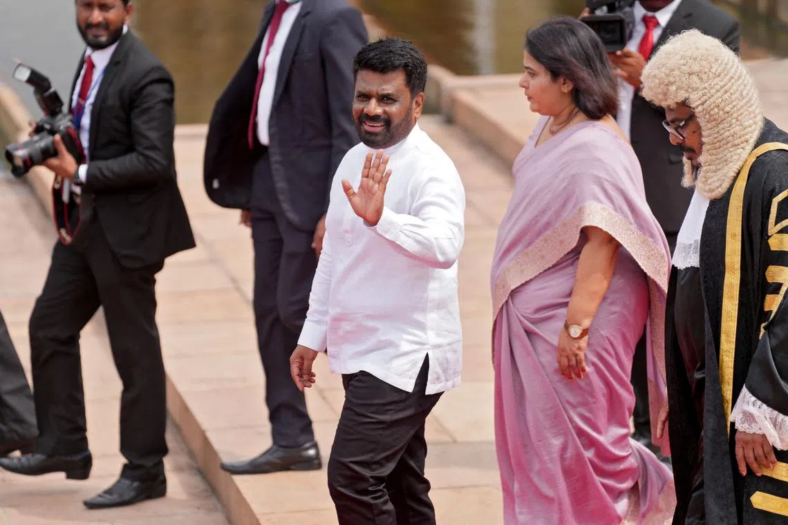 Sri Lanka's President Anura Kumara Dissanayake waves as he leaves after attending the opening of the new session of parliament, in Colombo, Sri Lanka, November 21, 2024.  REUTERS/Thilina Kaluthotage/ File Photo