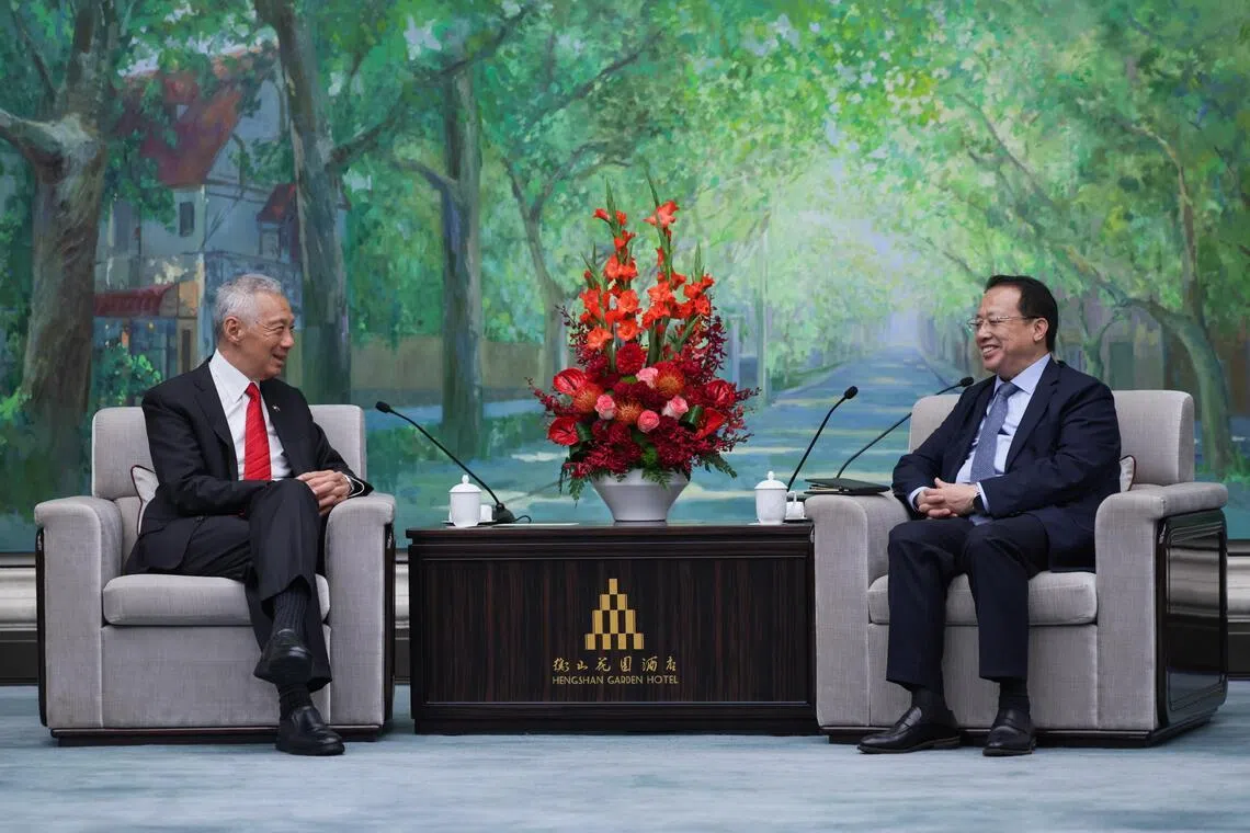 Senior Minister Lee Hsien Loong (left) in a conversation with Shanghai Mayor Gong Zheng during their meeting at Hengshan Garden Hotel on May 22.