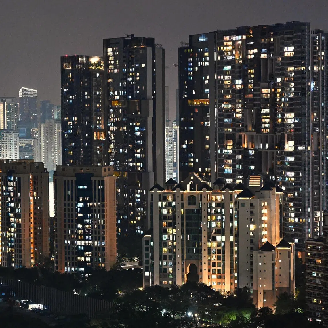 Generic photos of the private and HDB residential buildings with its lights on at night, as seen from Dawson on April 5, 2026. Can be used for energy, gas, power, electric, electricity price stories.
