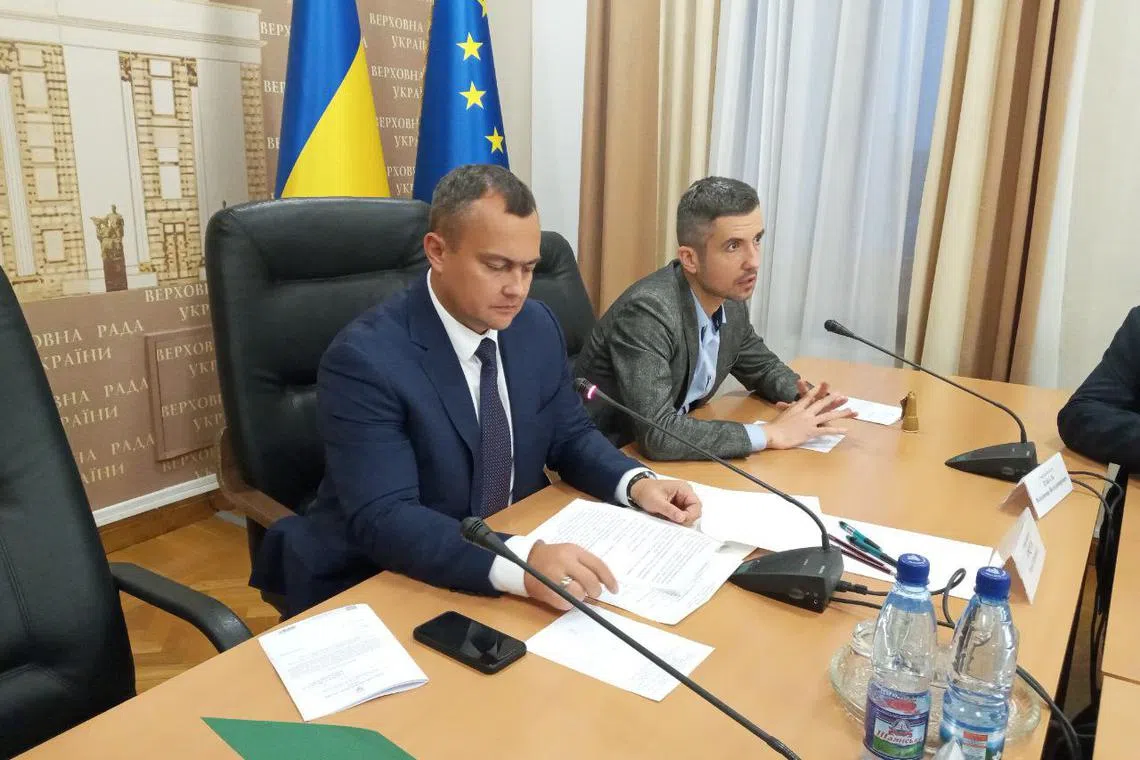 Yuriy Aristov (left) travelled to Lithuania for a work trip, but then faked sick leave and went to a luxurious hotel in the Maldives with his family, investigators say.