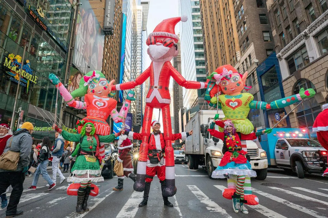 Revellers take part in SantaCon in New York City, U.S., Dec10, 2022. 