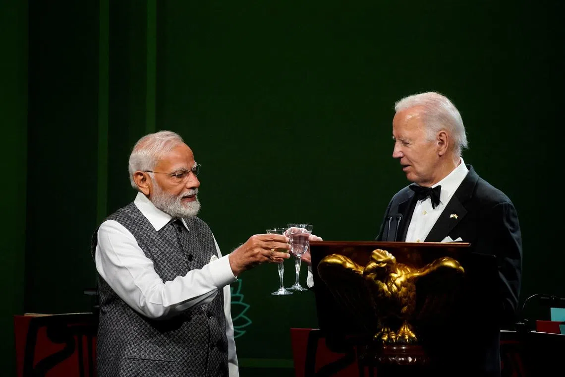US President Joe Biden (right) and India's PM Narendra Modi toast during an official state dinner at the White House in Washington on June 22.